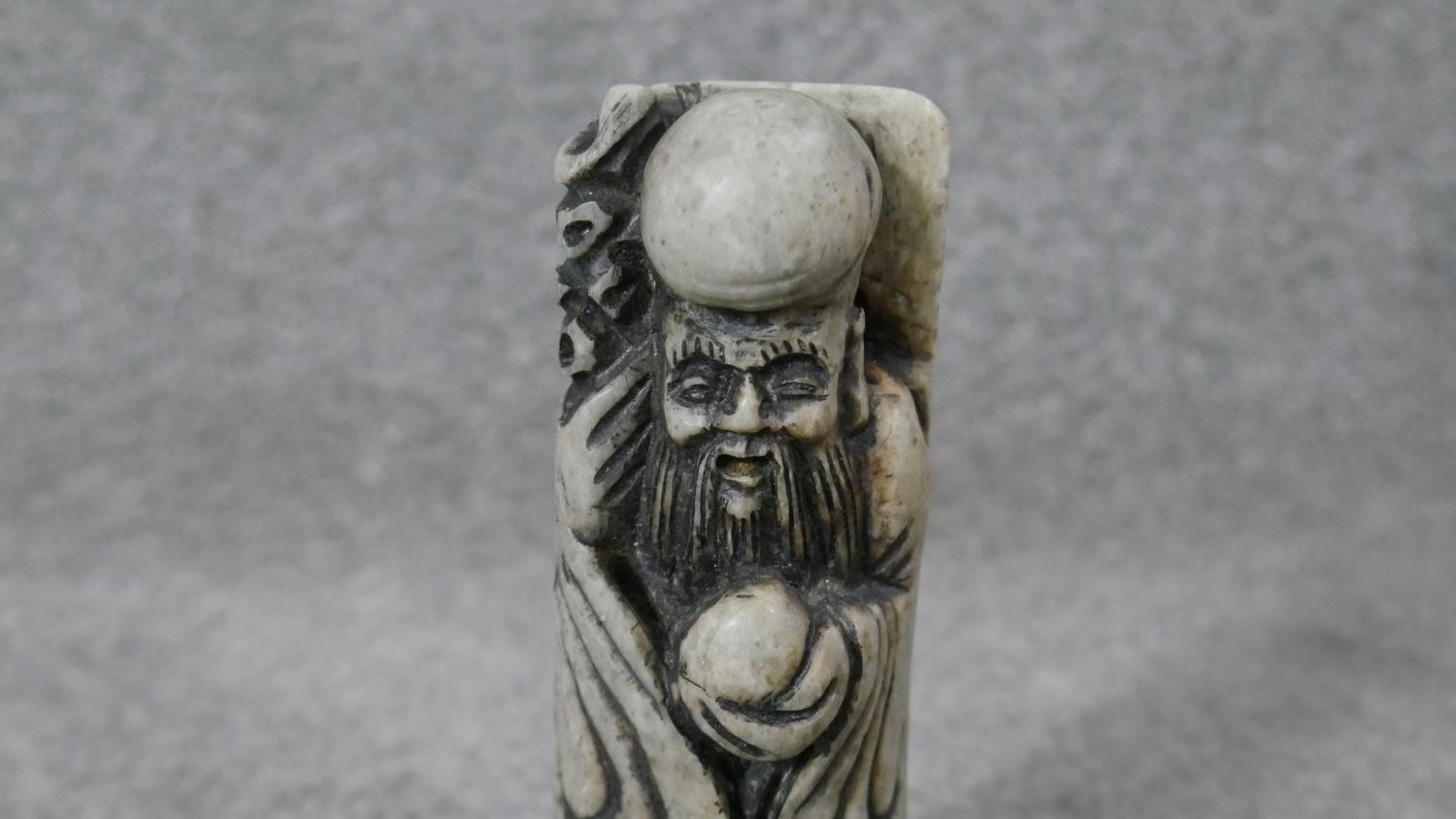 A carved Chinese soapstone chop in the form of an immortal along with two Indian brass deities on - Image 4 of 10
