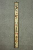 A framed and glazed early 20th century cross stitched sampler. H.159 W.15cm.