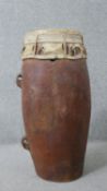 A large vintage tribal hardwood drum with animal hide cover. H.58 W.26cm