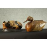 A carved and painted cat figure and a similar of a duck. H.30 W.53 D.15 cm. (largest)