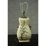 A Chinese style gilded twin handled vase, decorated with fruit blossom design table lamp. H.68cm