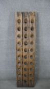 A wine storage stand from a champagne riddling rack. H.148 W.37 D.14 cm