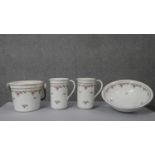 A four piece Victorian ceramic wash set, each decorated with a rose design. Numbered to the base.