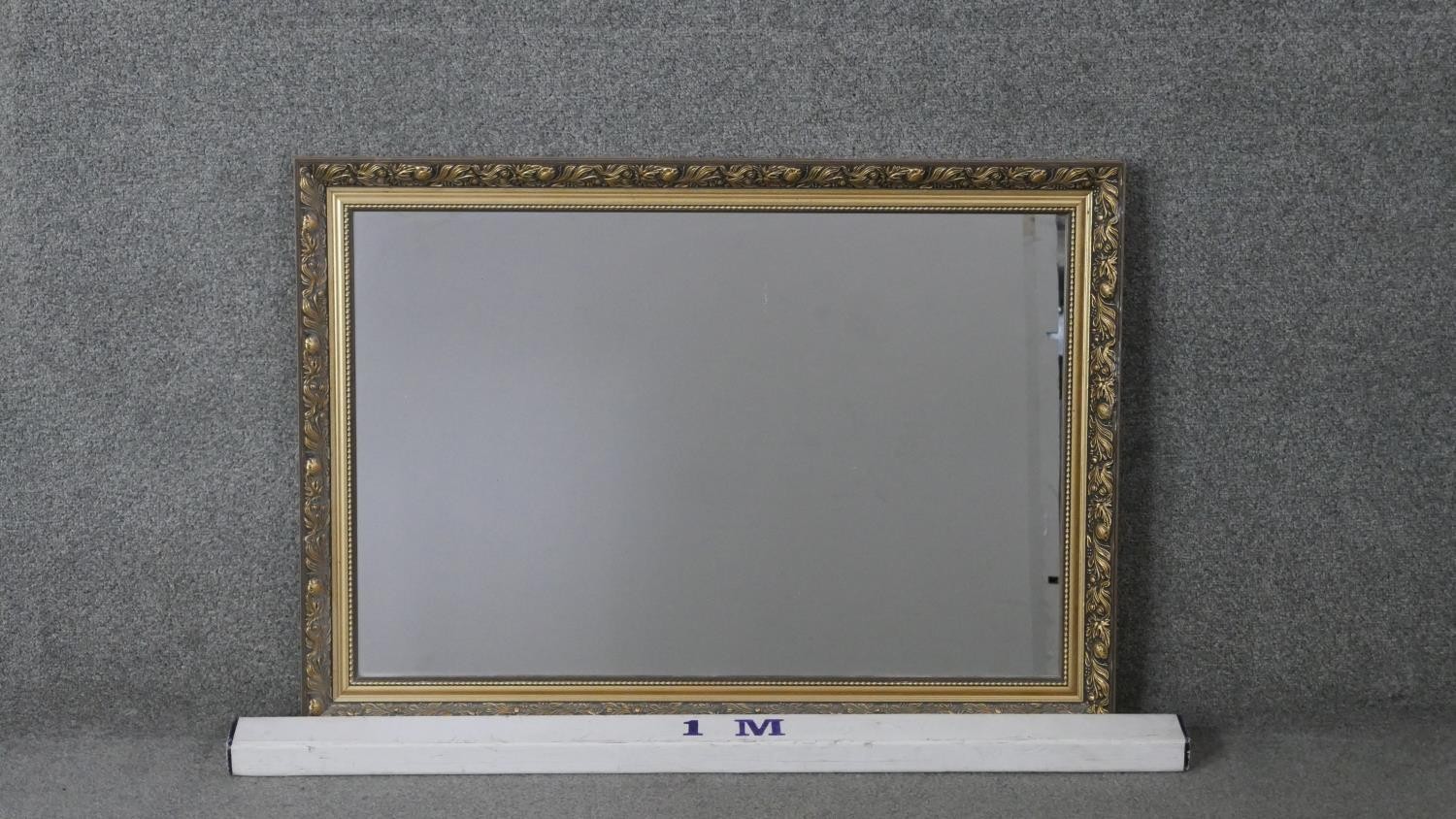 A contemporary gilded wall mirror with pomegranate and foliate design. H.62 W.86 cm - Image 2 of 4