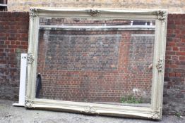 A very large mirror with bevelled plate in Rococo style frame.