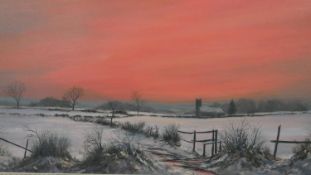 A framed oil on canvas of a snowy field at sunset. Signed A. Smith. H.65 W.117cm