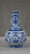 A large early 20th century Chinese blue and white hand painted porcelain onion vase with stylised