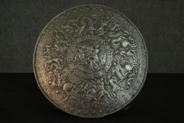 A 19th century style Renaissance relief Classical design cast iron shield. Dia.54cm.
