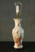 A Chinese hand painted ceramic vase converted into a table lamp. Decorated with chrysanthemums and