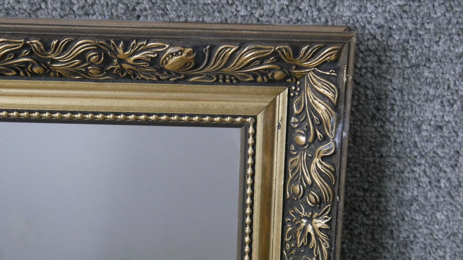 A contemporary gilded wall mirror with pomegranate and foliate design. H.62 W.86 cm - Image 3 of 4