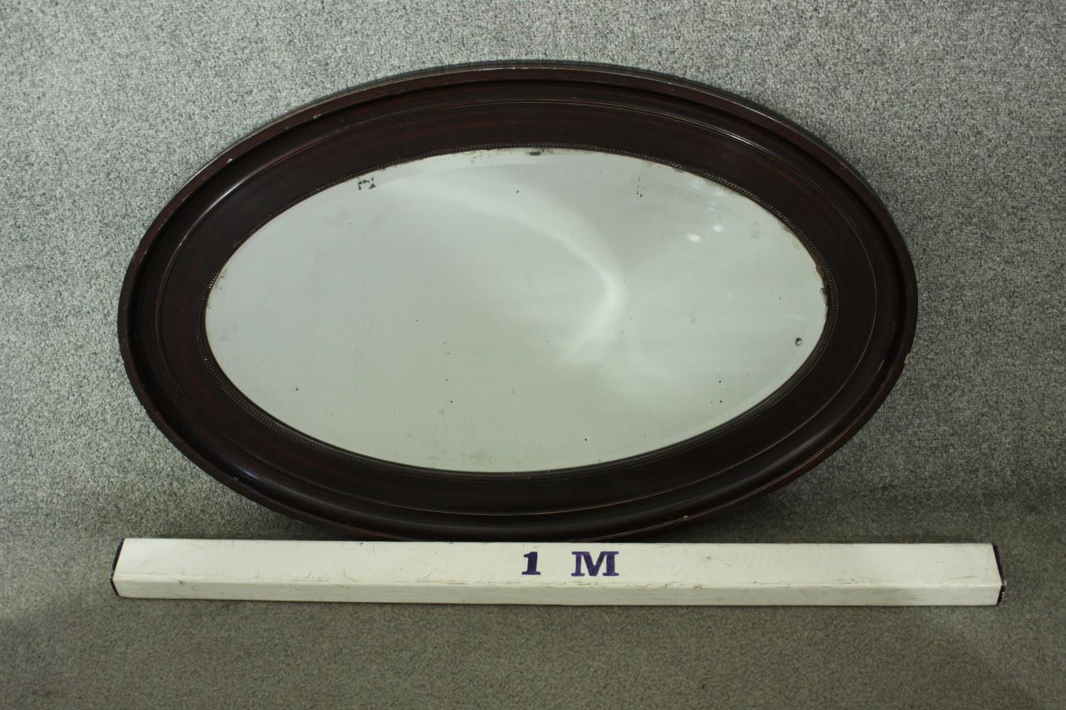 A Victorian ebonised framed oval wall mirror with bevelled plate. H.87 W. 61 cm. - Image 4 of 4