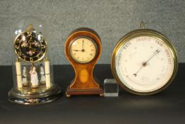 Two early 20th century mantle clocks and a barometer. One barometer, one satinwood inlaid mantel