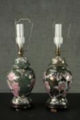 A pair of Oriental style rose design ceramic lustre urn vases converted to table lamps. Each sitting