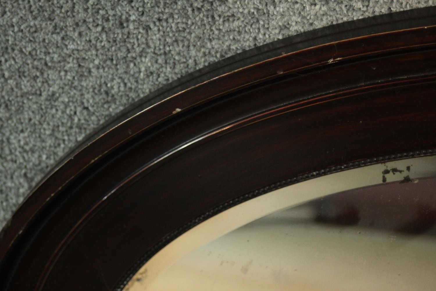 A Victorian ebonised framed oval wall mirror with bevelled plate. H.87 W. 61 cm. - Image 2 of 4