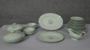 A Spode 'Flemish Green' eight person part dinner service. The set decorated with blue bell