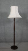 A vintage standard lamp with cream silk shade. H.170 W.60cm