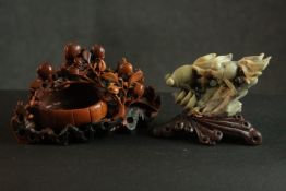 Two 20th century Chinese soapstone carvings. One of a fan tail gold fish and the other of peach