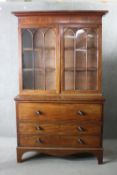 A late Georgian mahogany secretaire bookcase the upper astragal glazed section above fitted