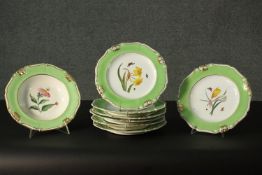 A set of seven 19th century Derby (Robert Bloor) green ground botanical plates, each painted with