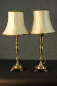 A pair of vintage brass table lamps on square bases with cream silk shades. H.65cm.