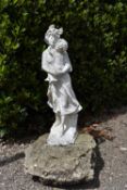 A white painted reconstituted stone garden figure, 19th century style mother and child.