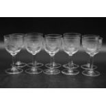 A set of ten machine engraved sherry glasses with a repeating geometric design. H.10 Dia.6cm (10)
