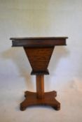 A Victorian walnut trumpet form work table with micromosaic inlaid top and fitted interior on