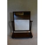 A Victorian mahogany swing frame dressing table mirror on platform base. H.75 W.61 D.28cm