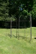 A set of seven wrought metal open garden panels of Gothic arch outline. H.190 W.237cm