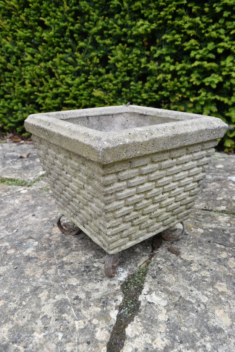 A pair of reconstituted garden planters on scrolling wrought metal bases. H.28 W.28 D.28cm - Image 5 of 5