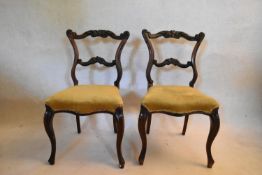 A pair of 19th century rosewood shaped back dining chairs on cabriole supports. H.79 W.45 D.42cm