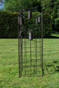 A set of four Chinese style metal framed lawn wind chimes. H.102 W.40cm (Some bells missing as