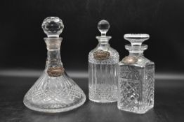 Three crystal cut glass decanters, Port, Gin and Scotch. H.30 Dia.20cm (port) (3)