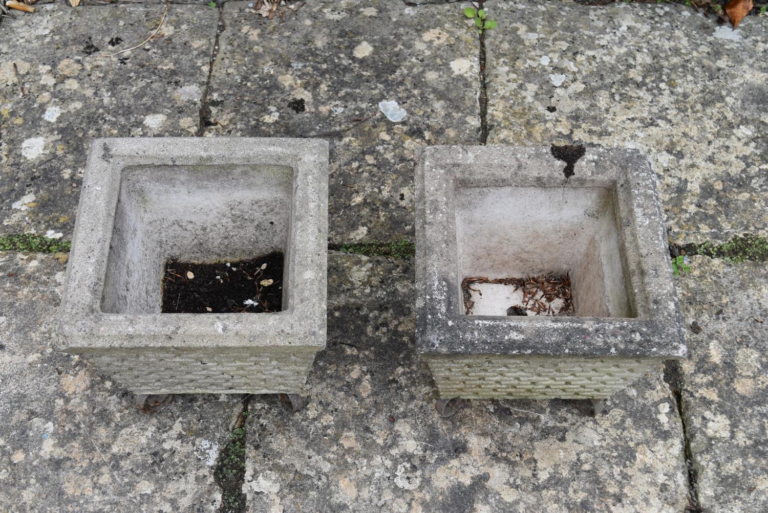 A pair of reconstituted garden planters on scrolling wrought metal bases. H.28 W.28 D.28cm - Image 3 of 5