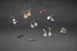 A miscellaneous collection of nine pairs of silver earrings.