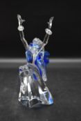 A cased Swarovski glass figure. H.20 W.10cm