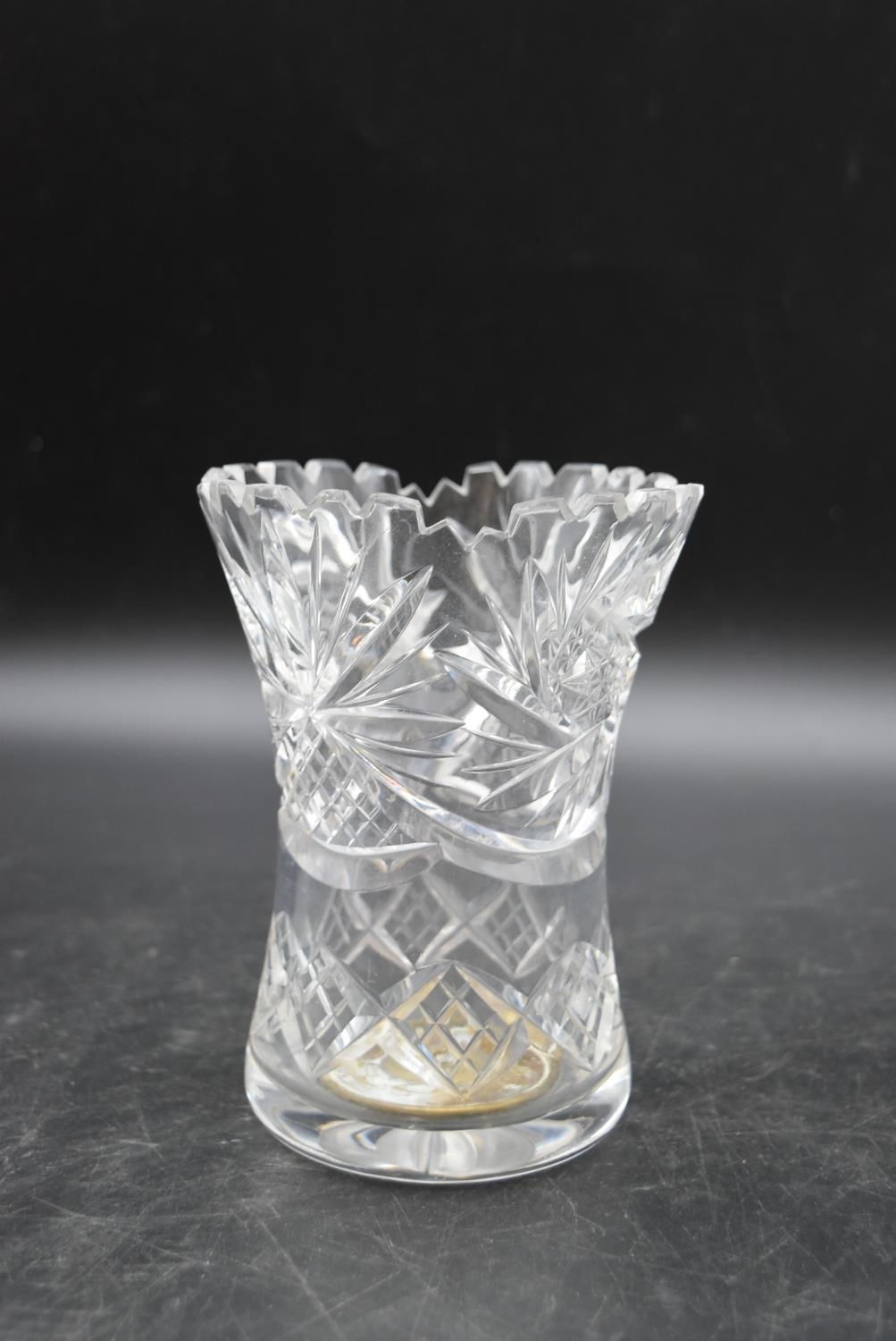 A set of three 20th century cut crystal glass topped decanters with a similar vase. H.27cm ( - Image 4 of 7