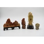 A collection of 20th century Chinese carved soapstone figures. Including a boulder mountain