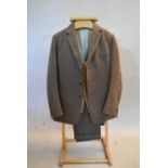 A three piece herringbone suit to include a suede waistcoat, bespoke c.42R