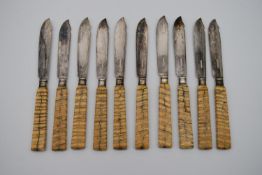 A set of ten late 19th century silver plated fish knives with fossilised mammoth tooth handles. L.