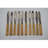 A set of ten late 19th century silver plated fish knives with fossilised mammoth tooth handles. L.