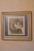 A framed and glazed charcoal study, female portrait, indistinctly signed and inscribed, dated
