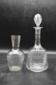 A late Victorian geometrically etched glass decanter with stopper and matching water carafe. H.30