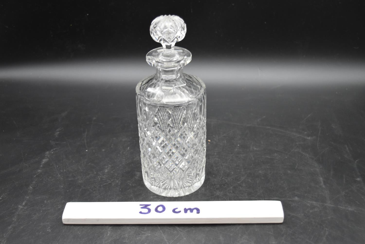 A set of three 20th century cut crystal glass topped decanters with a similar vase. H.27cm ( - Image 7 of 7
