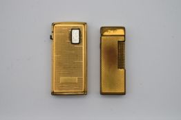 A vintage Dunhill lighter along with a Ronson Varaflame similar. H.7 W.4cm W.145g