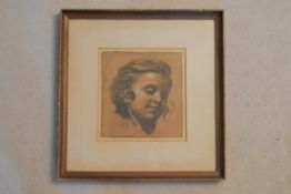 A framed and glazed charcoal study, child portrait, indistinctly signed. H.36 W.35cm