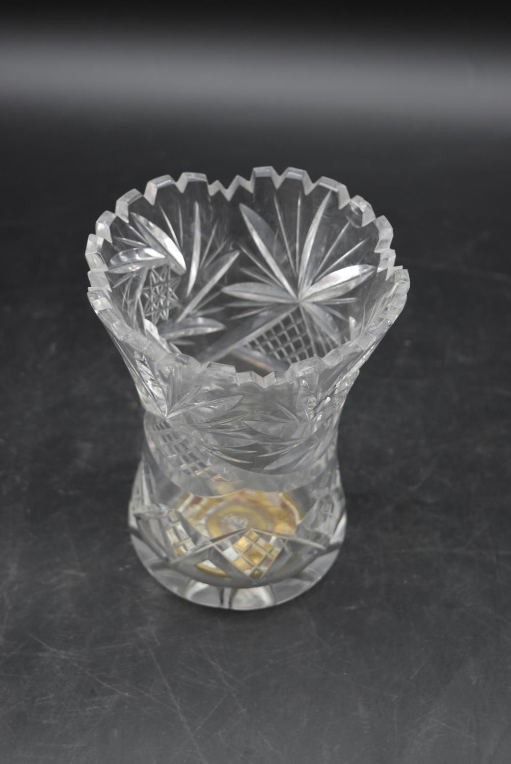 A set of three 20th century cut crystal glass topped decanters with a similar vase. H.27cm ( - Image 5 of 7