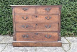 A Georgian mahogany chest with two short above three long drawers flanked by fluted pilasters on