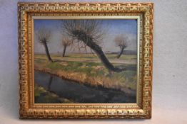 Wilfred S Pettitt, a gilt framed oil on board, "A Willowed Dam in Spring" signed with label to the