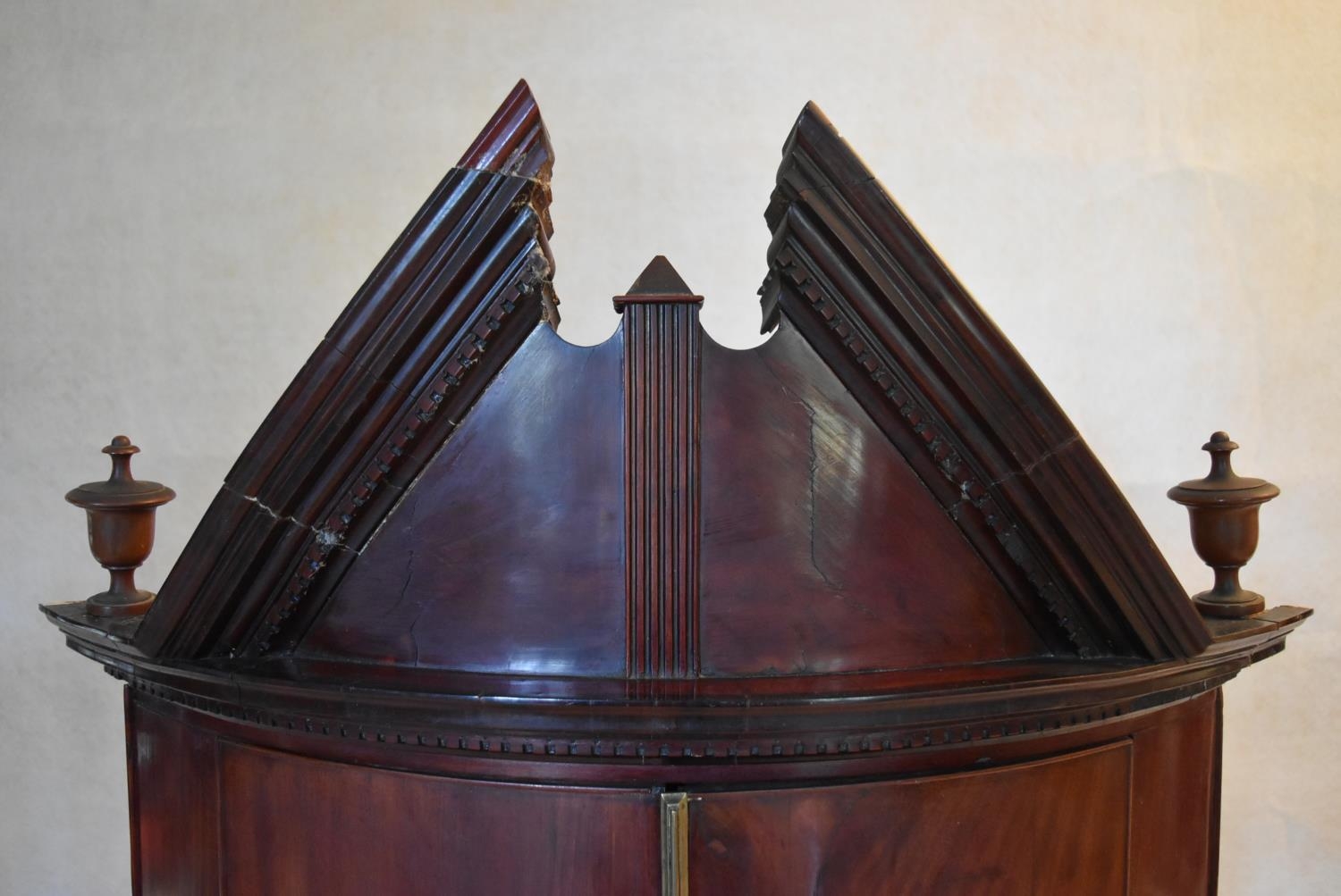 A Georgian mahogany bowfronted hanging corner cabinet with arched pediment and urn finials and - Image 7 of 10